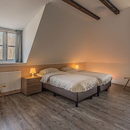 Gezellige slaapkamer in Type W vakantiehuis, De Cocksdorp Texel met comfortabele bedden.