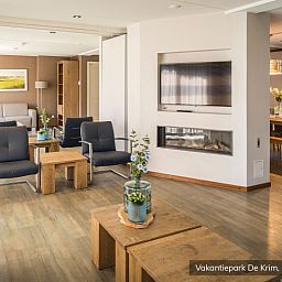 Spacious living room in Family Villa 16 persons, De Cocksdorp, Texel with modern furnishings.