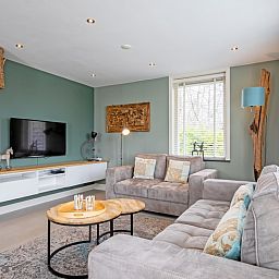 Gezellige woonkamer in Bungalow Postweg 109, De Cocksdorp, Texel. Comfortabel vakantiehuis op de Waddeneilanden.