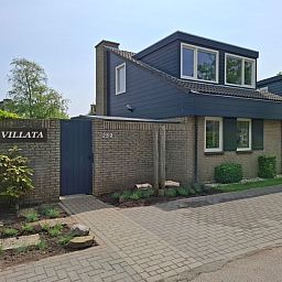 Vakantiehuis B 289 in De Cocksdorp, Texel biedt een charmante voorgevel met moderne architectuur, ideaal voor een ontspannen verblijf op de Waddeneilanden.