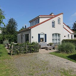 Vacation home D 692 in De Cocksdorp, Texel offers charming accommodation with a sunny terrace and green garden, ideal for a relaxing vacation.