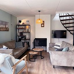 Gezellige woonkamer van Vakantiehuis D 709 in De Cocksdorp, Texel. Comfortabele zitruimte met moderne inrichting op de Waddeneilanden.