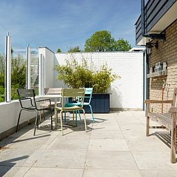 Geniet van de zon op het terras van Vakantiehuis A 345 in De Cocksdorp, Texel. Ontspan in deze vakantiewoning op de Waddeneilanden.