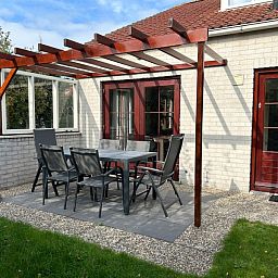 Vakantiehuis D 531 in De Cocksdorp, Texel, met zonnig terras en comfortabele zitruimte, ideaal voor ontspanning op de Waddeneilanden.