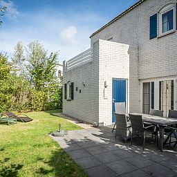 Enjoy the sun on the terrace of Holiday home F 549 in De Cocksdorp, Texel. Relax in the garden of this charming Wadden Island vacation home.