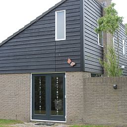 Vakantiehuis A 267 in De Cocksdorp, Texel, biedt een moderne uitstraling met natuurlijke omgeving op de Waddeneilanden.