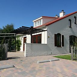 Vakantiehuis D 662 in De Cocksdorp, Texel, biedt een charmant verblijf met een zonnig terras en traditionele architectuur op de Waddeneilanden.