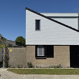 Vacation home A 301 in De Cocksdorp, Texel, offers a modern exterior with quiet surroundings on the Wadden Islands.