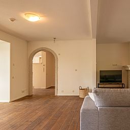 Cozy indoor area with fireplace in Kamerstraat 66 vacation home in De Koog Texel for cozy evenings.