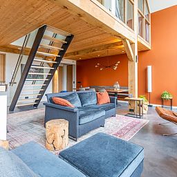 Stylish interior of Villa 191 with Hot tub in De Koog, Texel, with wooden details and spacious layout.