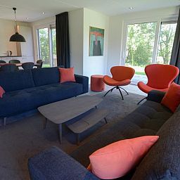 Comfortable sitting area in 06 - Razende Bol - allotment vacation home in De Koog, Texel with garden view.