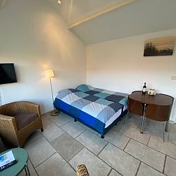 Slaapkamer van Studio Ooster - Brink 28, De Koog, Texel, comfortabel vakantiehuis op de Waddeneilanden.