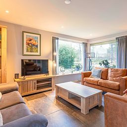 Gezellige woonkamer in Huis ter Duin, vakantiehuis in De Koog, Texel met ruime zithoek.