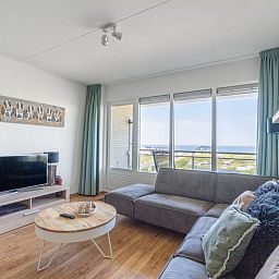 Comfortabele zithoek met panoramisch uitzicht in Appartement Juliana 102 Zeezicht, Texel.