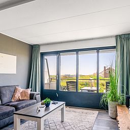 Cozy sitting area in Apartment Juliana 094 Island and Sea View, De Koog, Texel overlooking dunes and sea.