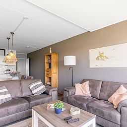 Spacious living room with open kitchen in Apartment Juliana 094 Island and Sea View, De Koog, Texel.