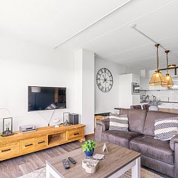 Modern living room and kitchen in Apartment Juliana 094 Island and Sea View, De Koog, Texel with stylish interior.