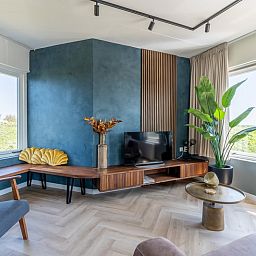 Cozy sitting area in Apartment Juliana 120 Eilandzicht, De Koog, Texel with a view of nature.