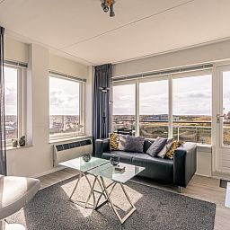 Modern furnished living room of Apartment Juliana 132 Eilandzicht in De Koog, Texel overlooking the dunes.