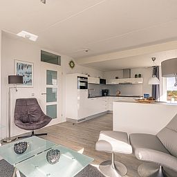 Stylish sitting area and kitchen in Apartment Juliana 132 Eilandzicht, De Koog, Texel, ideal for a relaxing stay.
