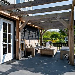 Gemuetliche Veranda im Residence Rustic Ferienhaus in De Koog, Texel