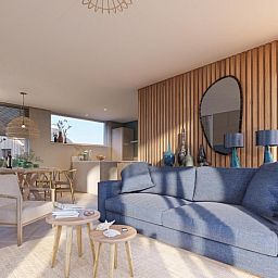 Stilvolles Wohnzimmer in der Duinvilla Wellness 6, De Koog, Texel, mit komfortabler Einrichtung und viel Licht.