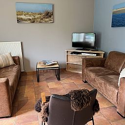 Gezellige woonkamer in Koetshuis 2, vakantiehuis in De Koog, Texel.