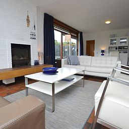 Comfortable sitting area in Orchismient 18 large vacation home, De Koog, Texel overlooking the garden.