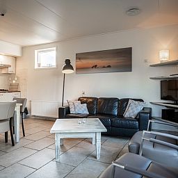 Comfortable sitting area in Holiday Home De Heggemus, Den Burg, Texel with stylish furnishings.