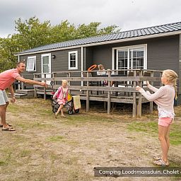 Comfortable living room in Chalet Geul 4p, Den Hoorn Texel, with modern furniture and lots of natural light.