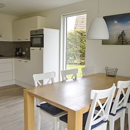 Modern kitchen in Type I - No. 89 Lark, vacation home in Oosterend, Texel, with dining area and lots of natural light.