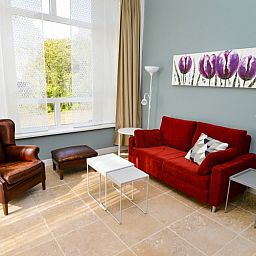 Comfortable living room with a view of nature at Bed & Bed, a bed and breakfast in the polder Eierland, Texel.