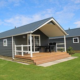 Veranda of Lodge - 6 persons in De Dennen, Texel, ideal for relaxation.