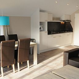 Dining and kitchen area in Lodge - 6 persons, vacation home De Dennen, Texel.