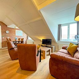 Spacious and bright living room of Apartment Bos en Duin 34 in De Dennen, Texel.