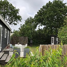 Relax on the terrace of Holiday Park de Bremakker - Chalet on Texel, Weideveld 80, surrounded by nature in De Dennen, Wadden Islands.