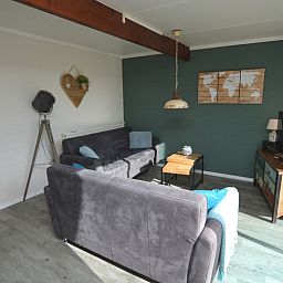 Gezellige woonkamer in Bungalow Verste Coogh 66, vakantiehuis in De Dennen, Texel.