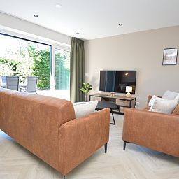 Gemuetliche Sitzecke mit Blick auf die Terrasse im Ferienhaus 't Hoogelandt 58, De Dennen, Texel.