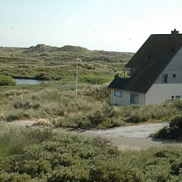 Nij Jit vakantiehuis in Midsland aan Zee Terschelling met weids uitzicht op duinlandschap.