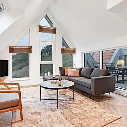 Dining area with view in 6-person penthouse 6LP, West-Terschelling, Wadden Islands, ideal for cozy meals.