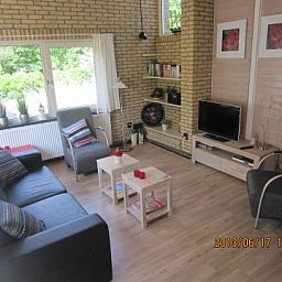 Gezellige woonkamer in De Klipper, vakantiehuis op Ameland, Waddeneilanden.