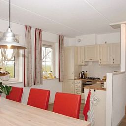 Kitchen and dining area in WEIDEVILLA B 6, Hollum, Ameland, vacation home with modern amenities.