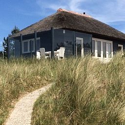 Charmantes Parnassia-Ferienhaus in den Duenen von Nes, Ameland, mit Panoramablick.