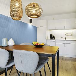 Stylish living room in Ameland State apartment, Nes, Ameland, with comfortable seating area.