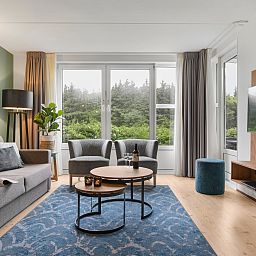 Exterior of Ameland State 4-person apartment in Nes, Ameland with balcony and terrace.