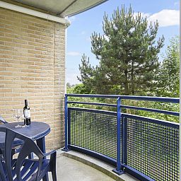 Modern kitchen and dining area in Ameland State 4-person apartment in Nes, Ameland.