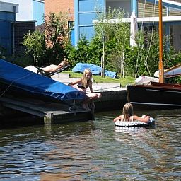 Cozy waterfront at Recreation Company 'on the water' in Heeg, Frisian lakes.