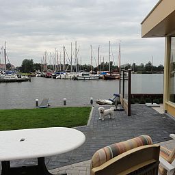 Vacation home FR518 with terrace by the water in Koudum, Frisian lakes.