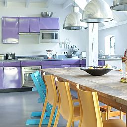 Modern kitchen in Holiday home in Kollumerpomp, Lauwersmeer, equipped with colorful furniture and spacious dining area.