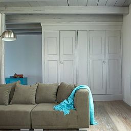Stylish indoor space in Holiday Home in Kollumerpomp, Lauwersmeer, with comfortable sofa and cozy furnishings.